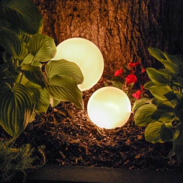 Glowing outdoor orbs at night.