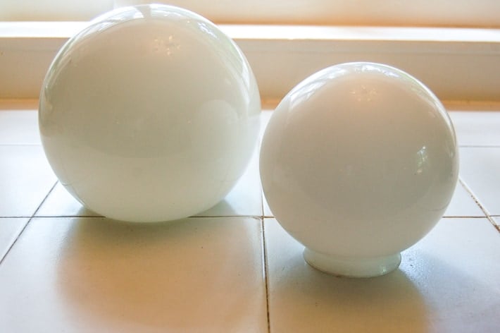 Opaque round glass shades.