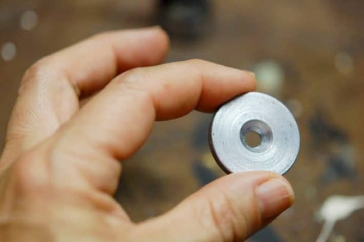 How to DIY magnetic gate latches that are invisible. 1" washer to be used as striker for magnet held up by two fingers.