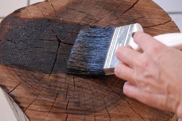 Brushing finish onto open end of wood 