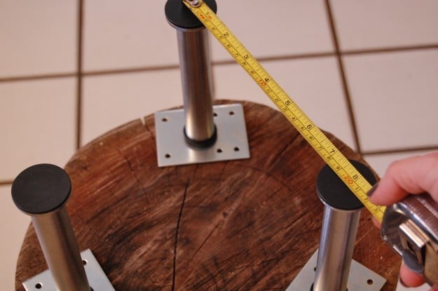 Measuring distance between table legs.