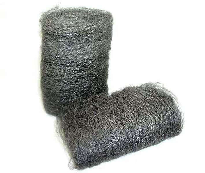 Two big pads of fine steel wool on a white background.