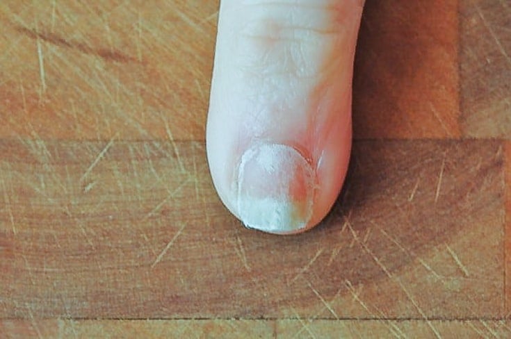 Pinkie nail with teabag glued on.