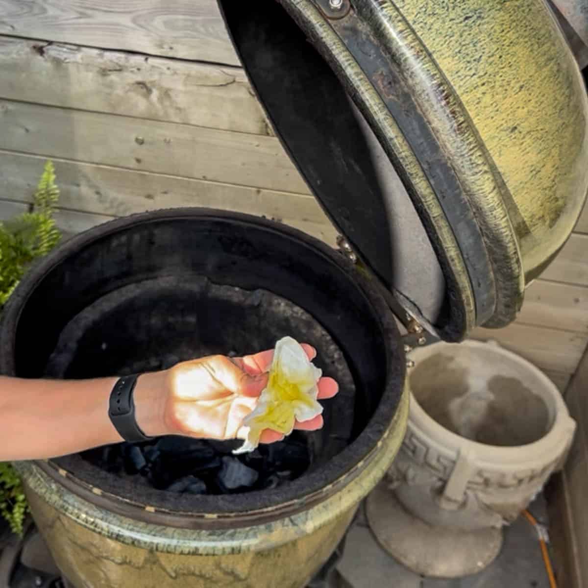 Paper towel soaked with olive oil for lighting a smoker or grill.