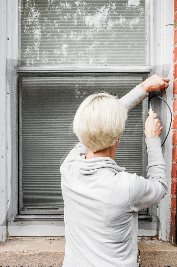 Rolling spline roller up channel to lock window screen in place.