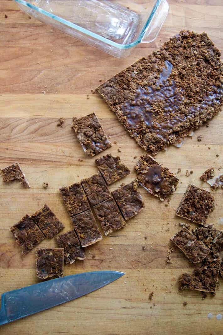 Melted wax and sawdust fire starters looking very much like delicious caramel toffee on a wood countertop.