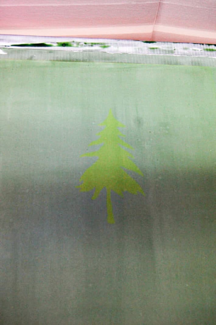 A complete, easy to follow guide to screen printing t shirts at home. Newly burned screen printing frame with a faint pine tree silhouette.