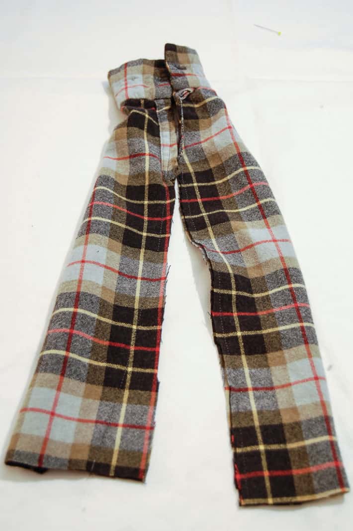 Plaid flannel shirt sleeve cut in half to the cuff.