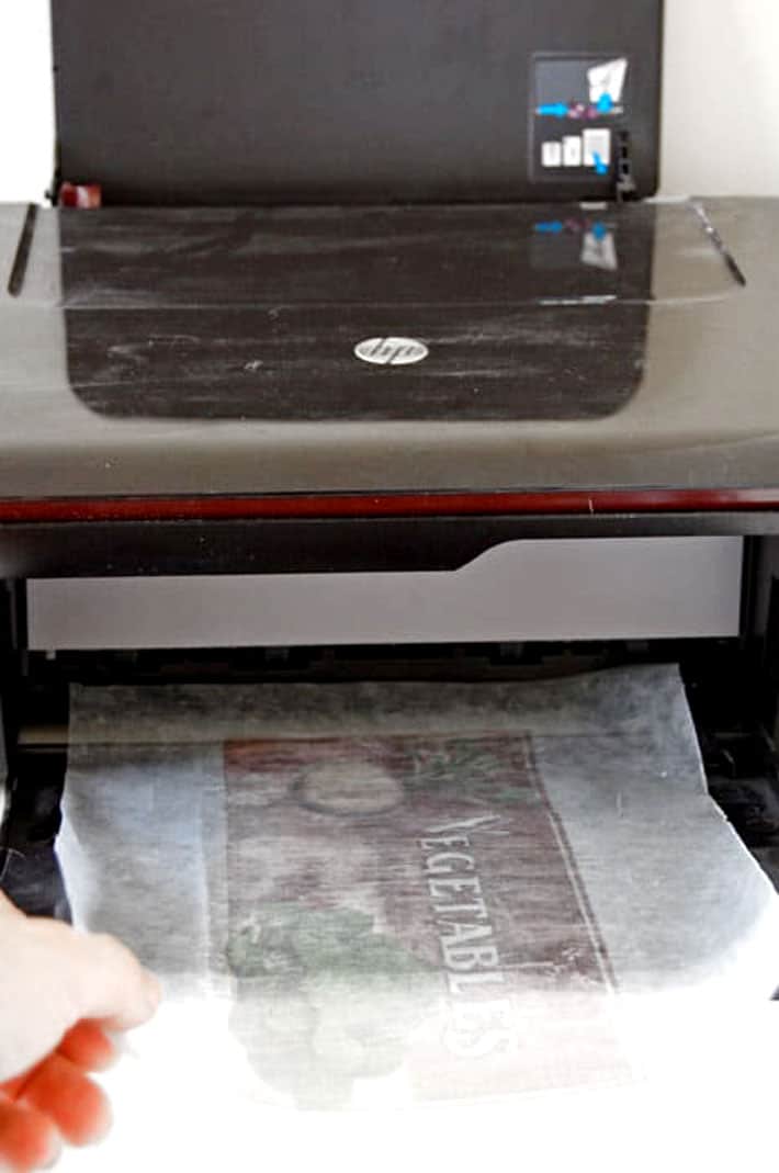 Printed wax paper coming out of inkjet printer.