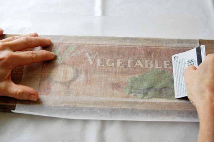 How to easily print on wood at home right now! Running credit card over wax paper to rub ink into wood.