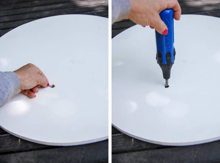 Attaching a DIY lazy susan to a tabletop by dropping a screw into the access hole and then screwing it in through the access hole.