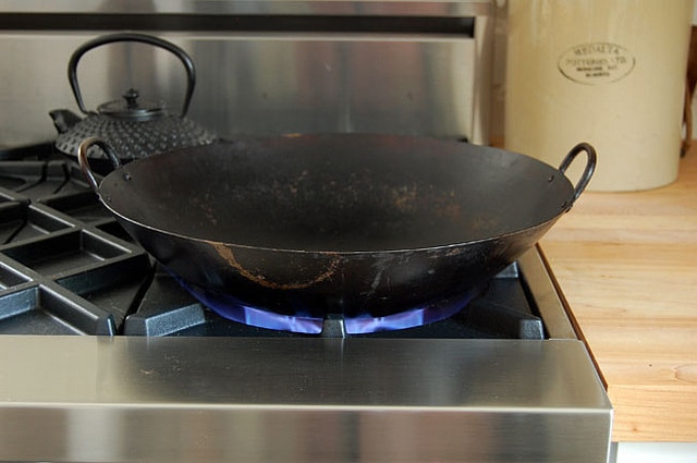 Cooking With Wok On Blue Star