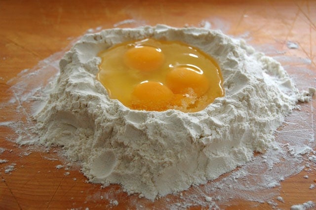 Pile of flower with well in centre filled with eggs. 