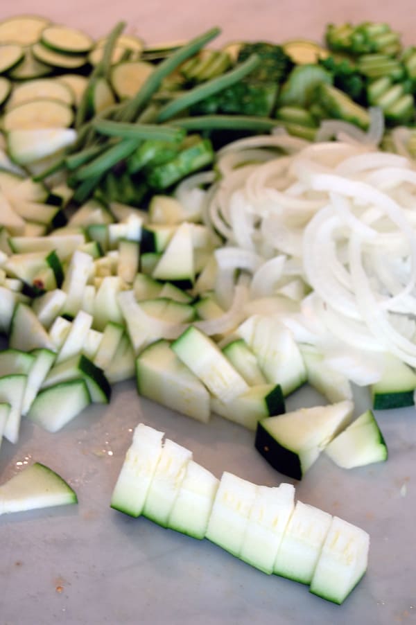 Zucchini sliced into bite sized triangles for pickling.