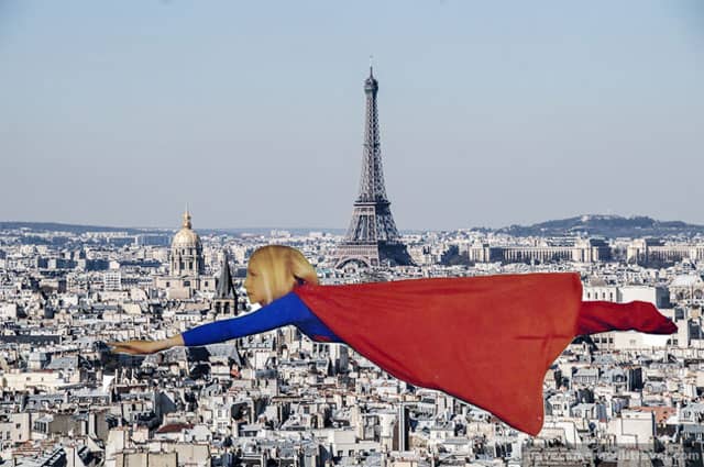 Karen Bertelsen dressed as Superwoman flying over Paris.