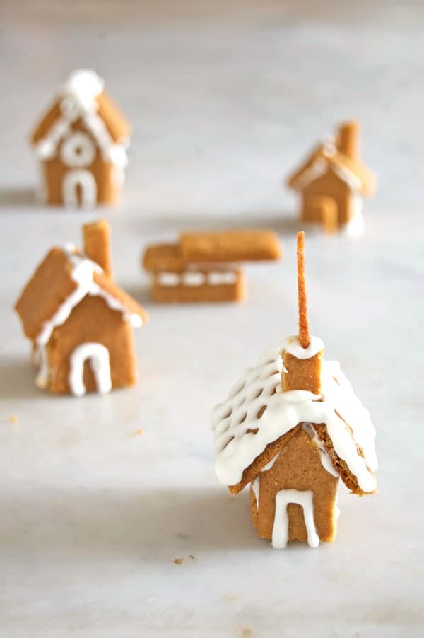 Collection of tiny gingerbread houses and churches.