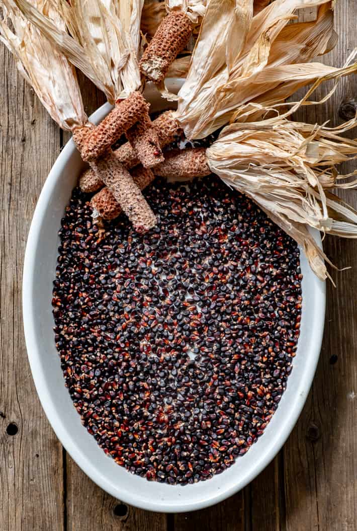 Dakota black popcorn kernels removed from cobs in a large ironstone platter.