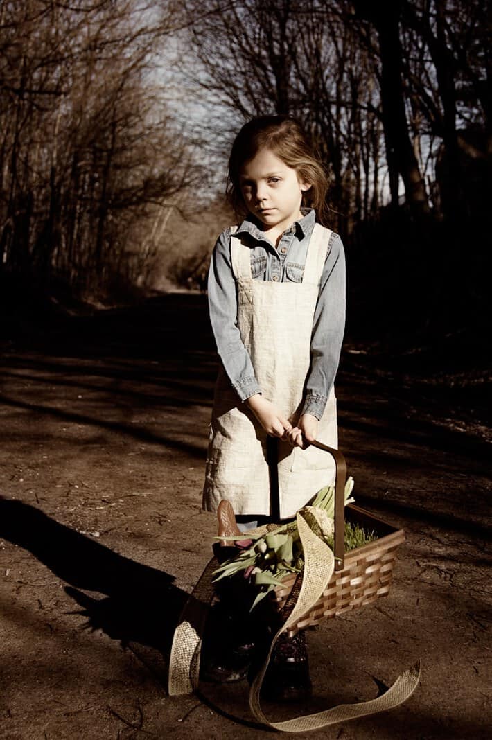 Girl with real grass easter basket.