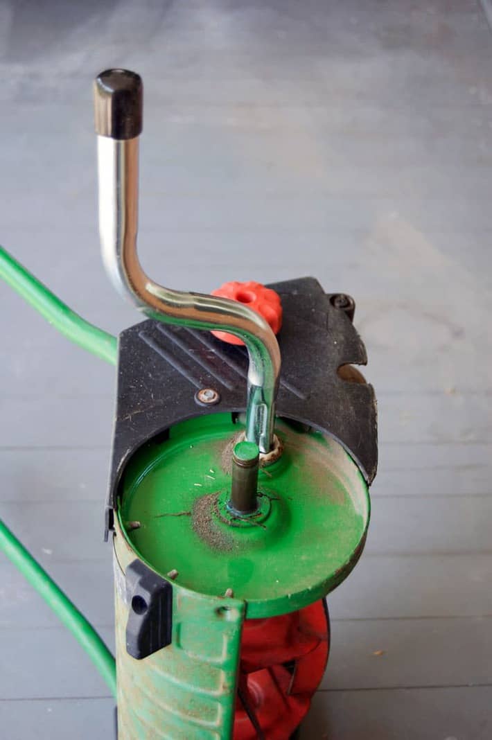 Hand crank attached to a push mower ready to sharpen.