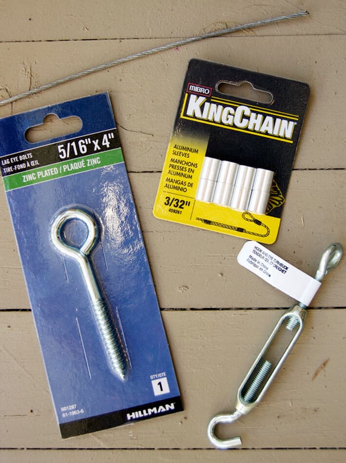 Lag eye bolt, aluminum sleeves, turnbuckle on wood deck.