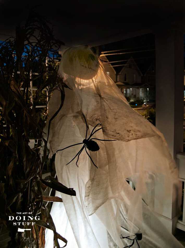 Make this life sized ghost decoration for your house in half an hour. White DIY halloween ghost decoration blowing in the wind.