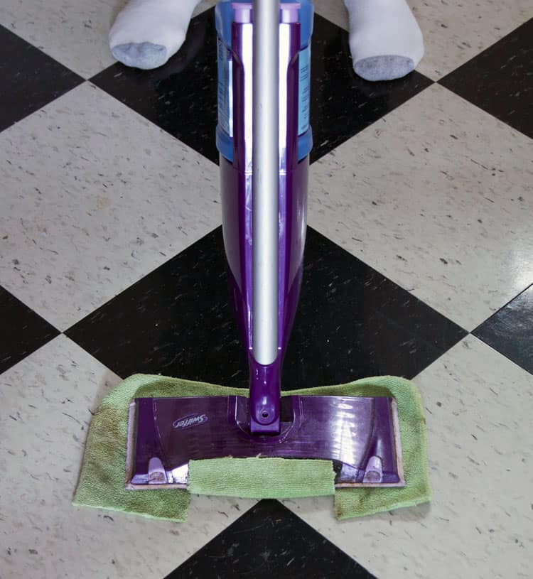 Swiffer Wet Jet with a microfibre cloth attached to the bottom to eliminate the need for special Wet Jet pads.