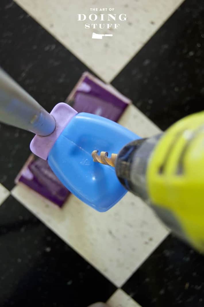 Drilling into the top of a Swiffer Wet Jet bottle so you can refill it.