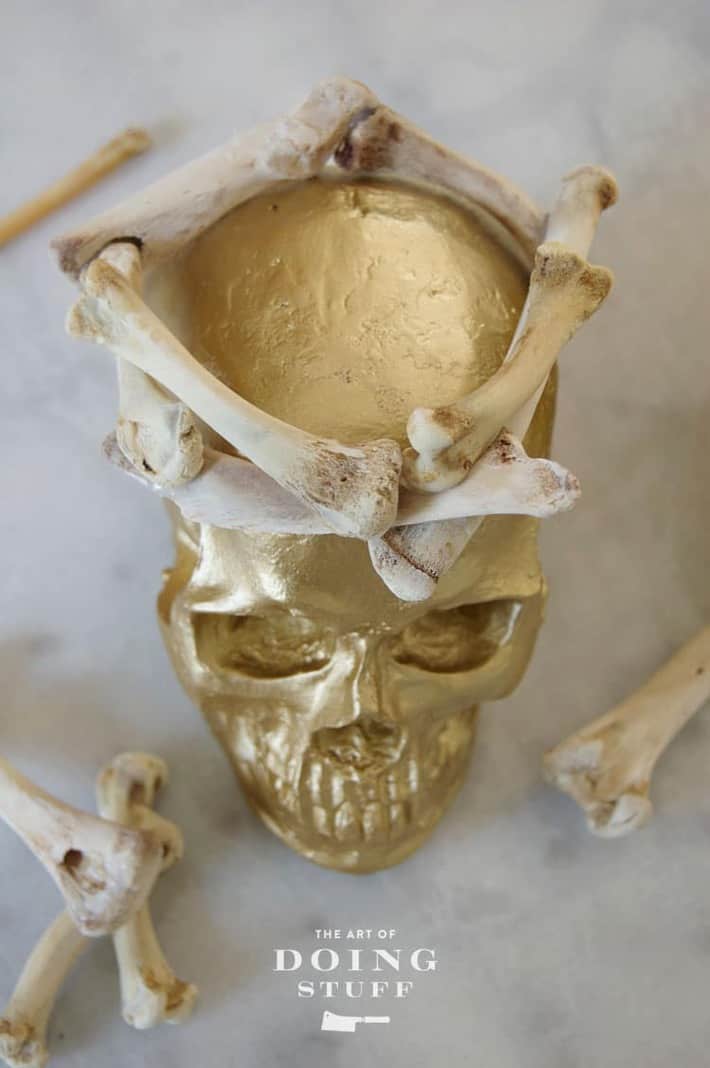 Looking down on gold skull wearing a crown.