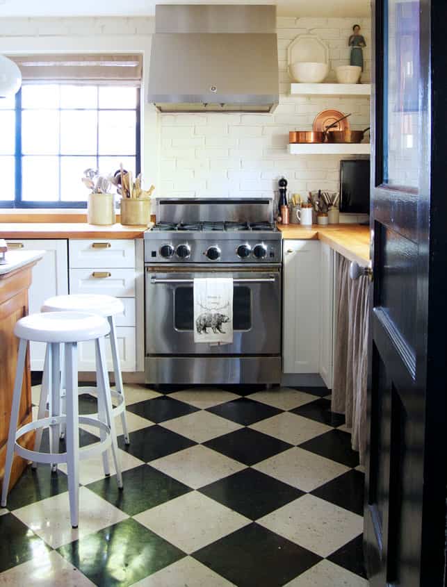 Black and white checked VCT tile in a modern country kitchen with Blue Star range.