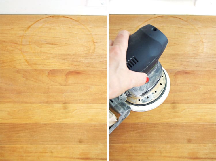 Sanding away water marks on a butcher block counter.