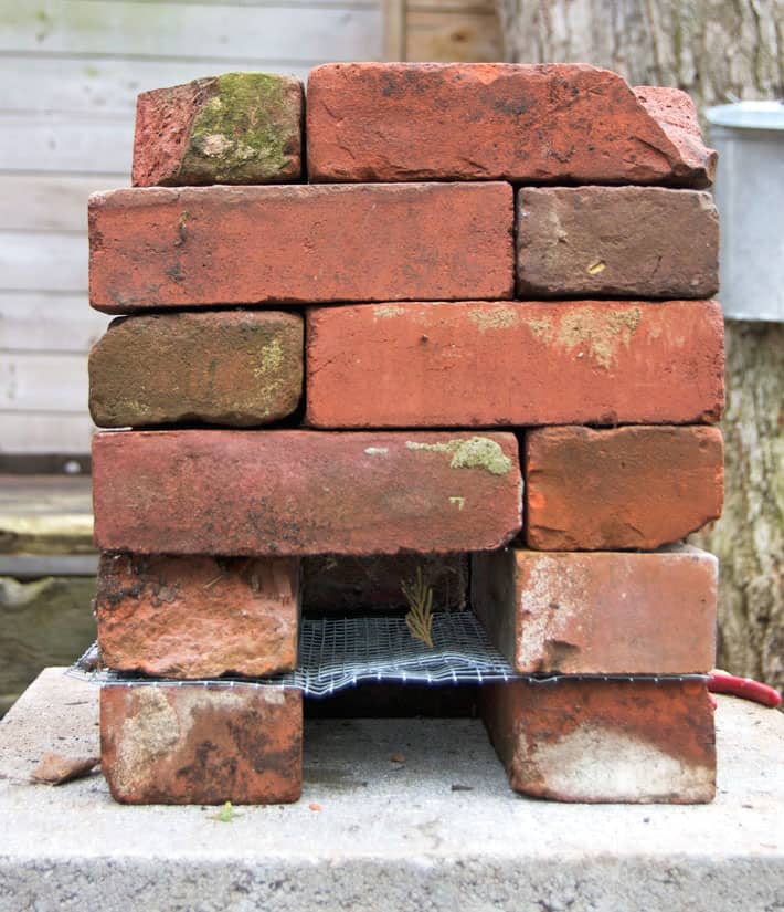 6 layers of stacked bricks forming a rocket stove.