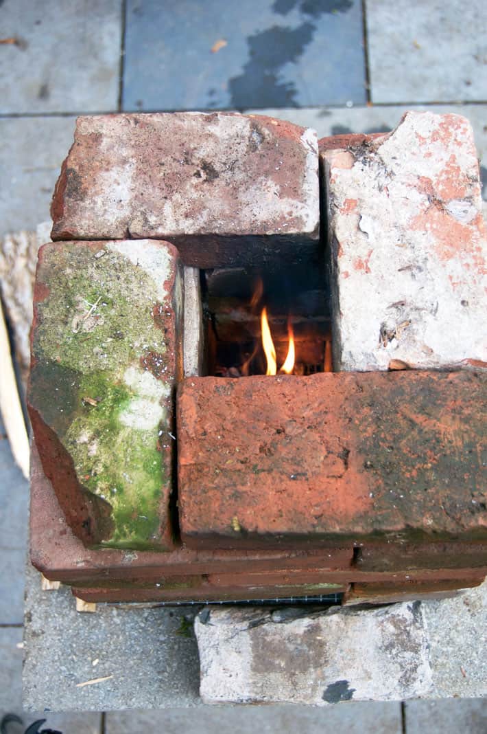 A look down the chimney in a burning brick rocket stove.