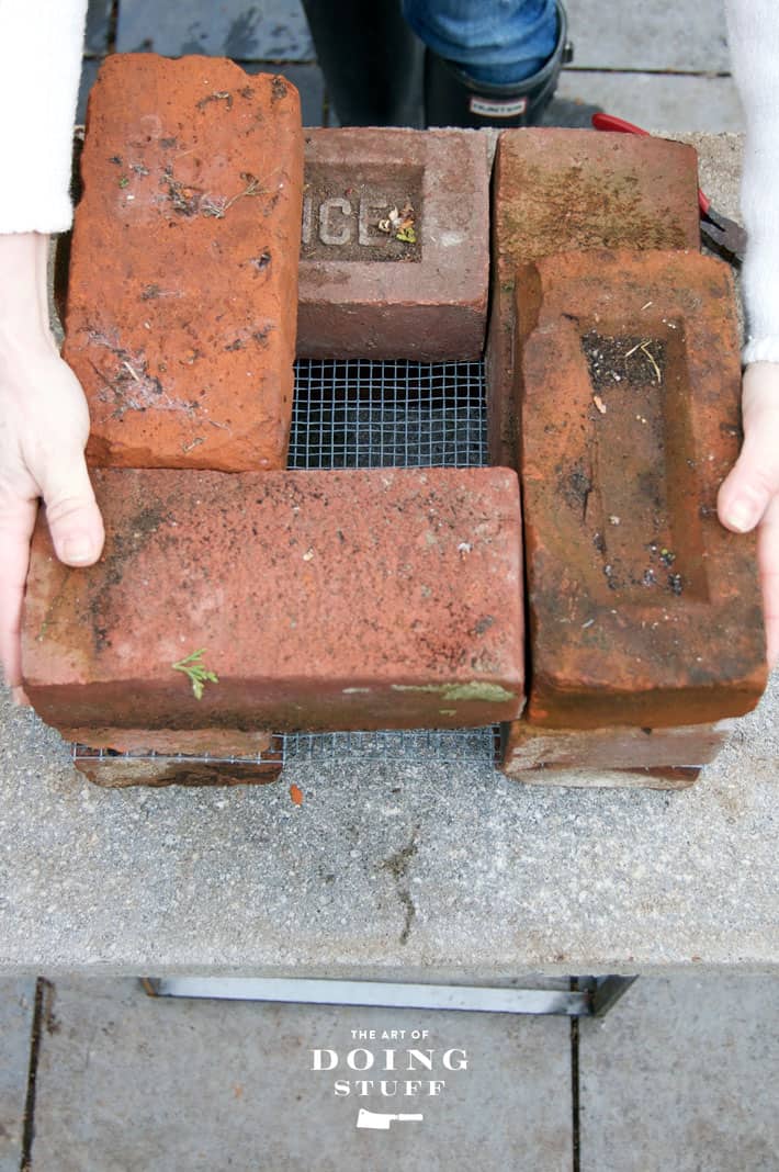 Assembling a rocket stove in 10 minutes with the 3rd layer of bricks.