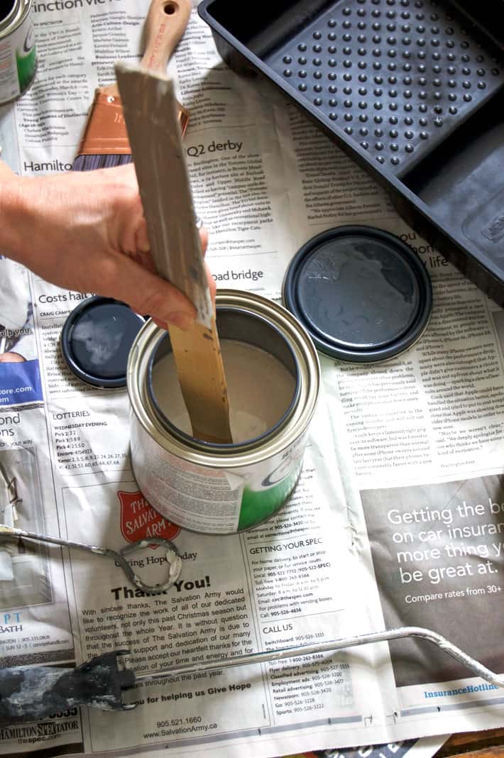 Paint an entire wall in your room or office with whiteboard paint. Here's how. Mixing activator and paint together with an old paint stick.