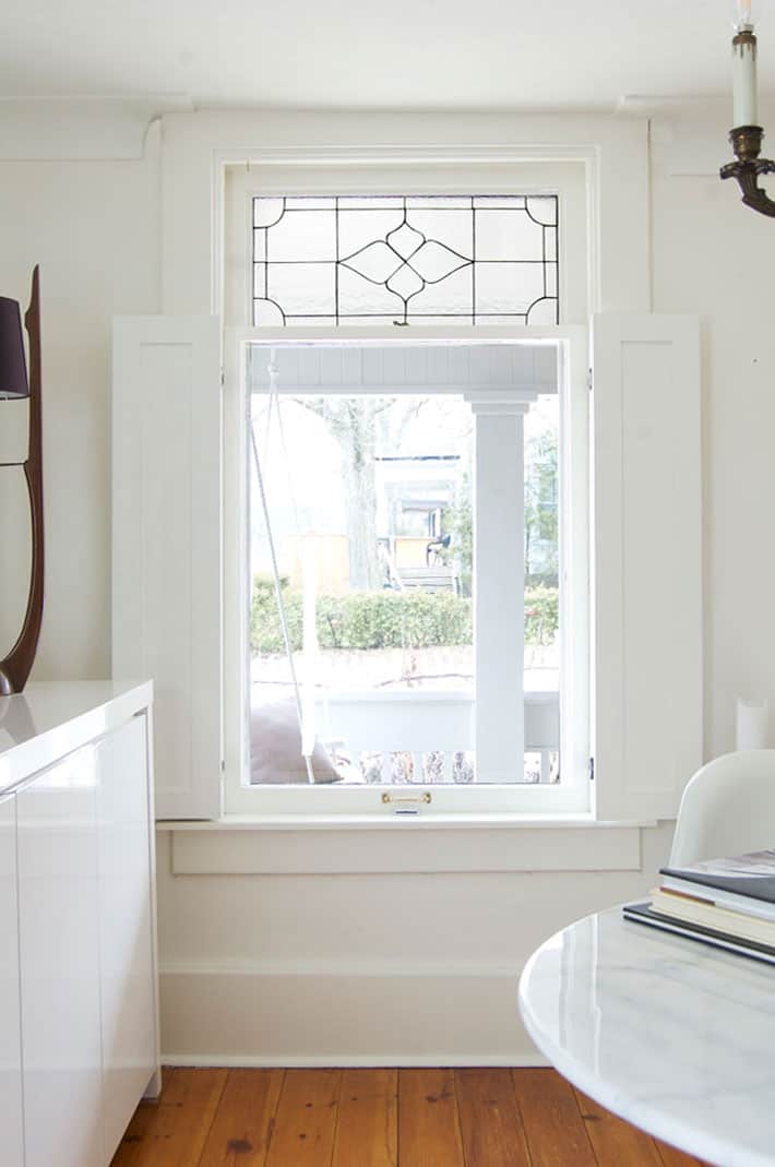 White shaker style DIY interior shutters in heritage home.