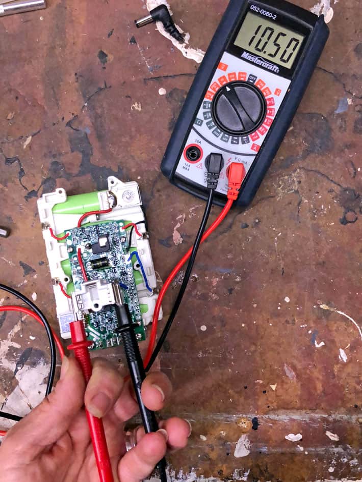 How to fix a new 18V battery that won't recharge. Checking the results of boosting a battery with a multimeter.
