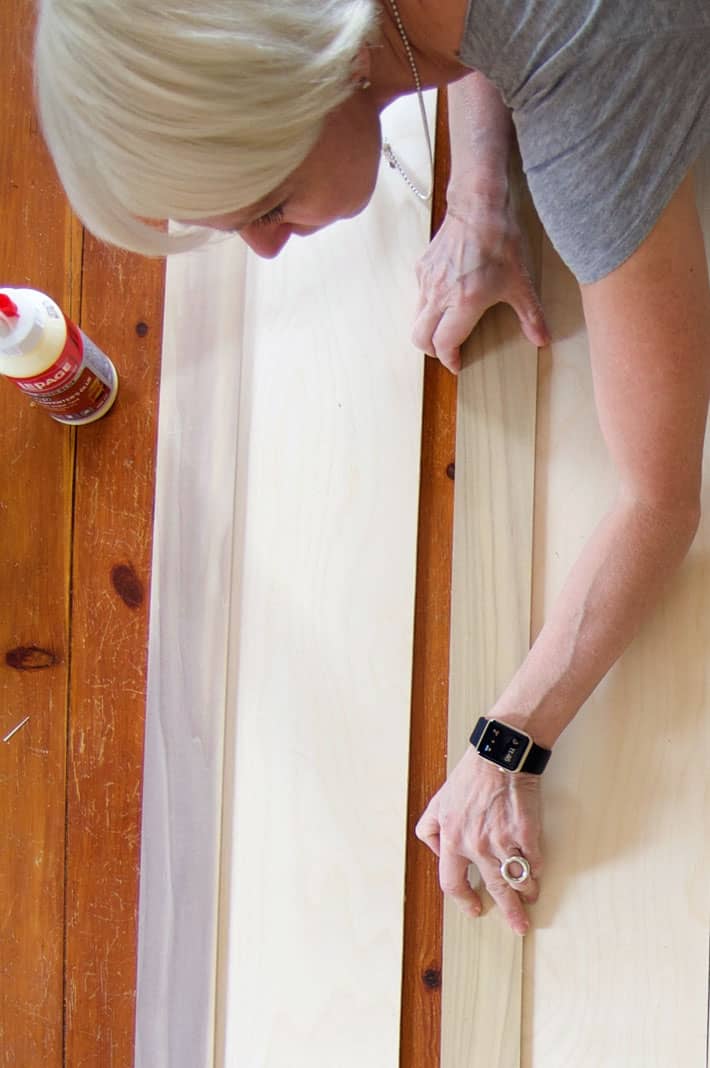 Placing 3" wood trim on birch plywood for interior shutters.