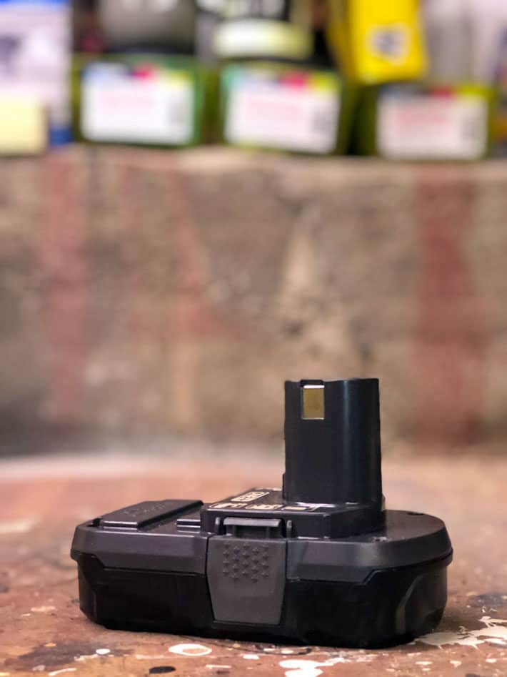 How to fix a new 18V battery that won't recharge. 18 volt rechargeable battery on workbench.