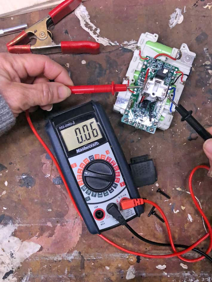 How to fix a new 18V battery that won't recharge. Testing 18 volt battery cell with multimeter with a reading of 0.06