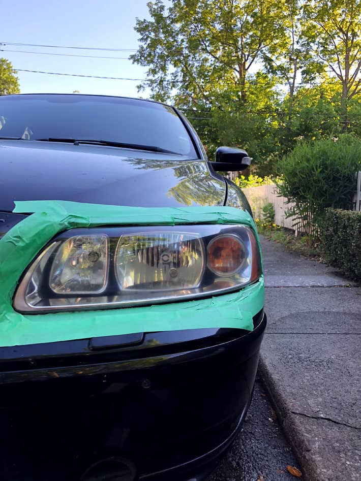 Fully rejuvenated car headlight after cleaning using sandpaper, buffing and headlight coating.