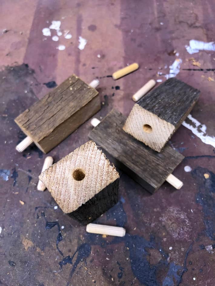 3" barn board blocks with holes and dowel pins in ends.