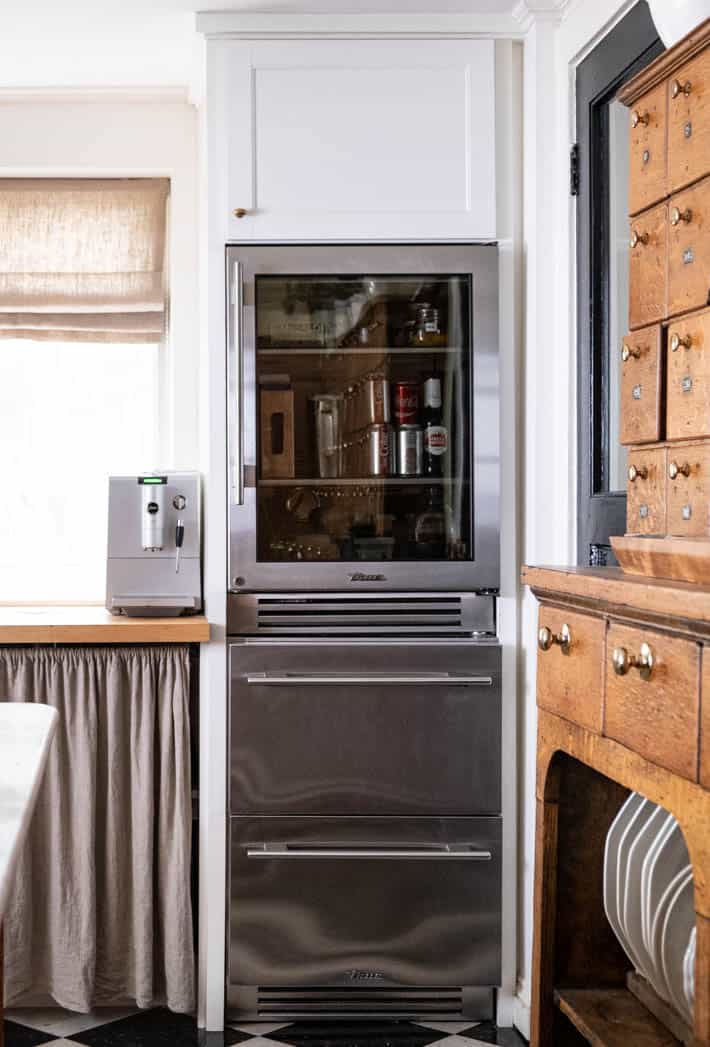 Restaurant style glass door refrigerator by True Residential, in a country kitchen.