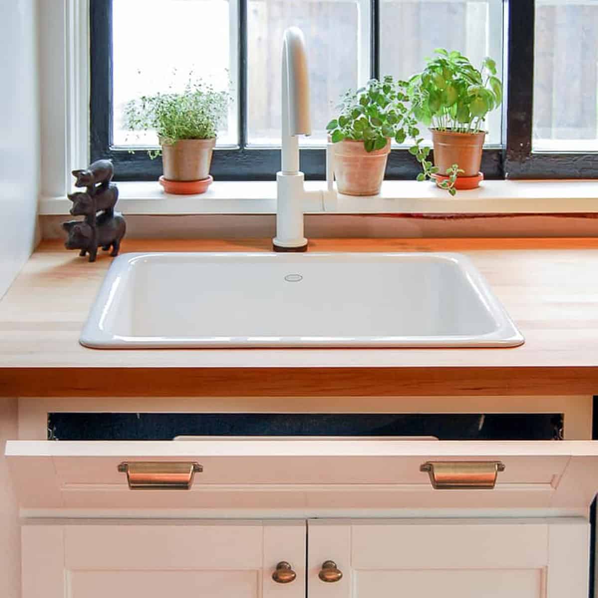 Under clearance sink trays