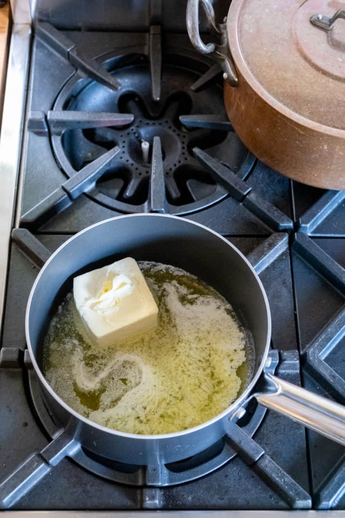 1 cup of butter melting in a non stick pot.