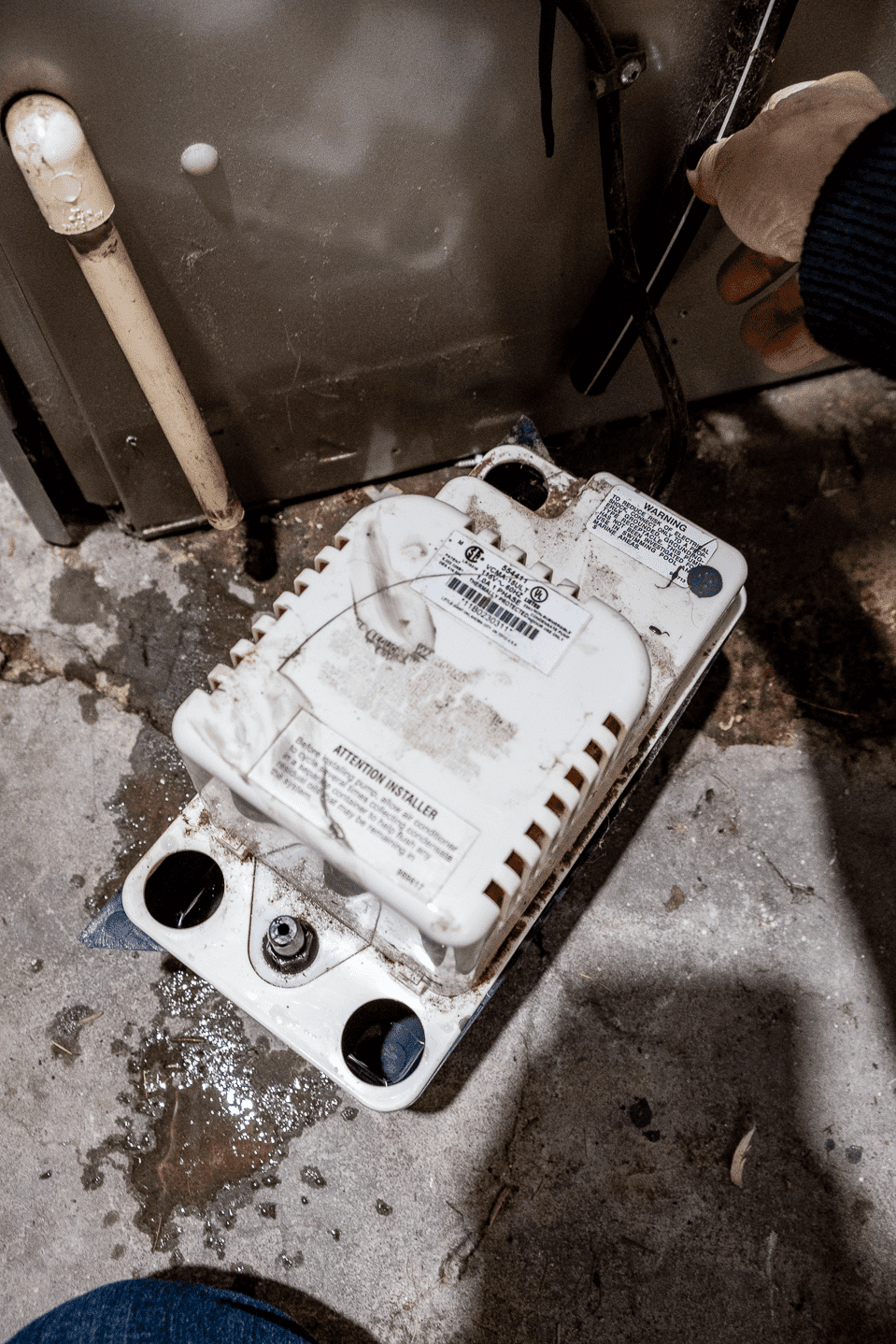 Old, clogged condensate pump.