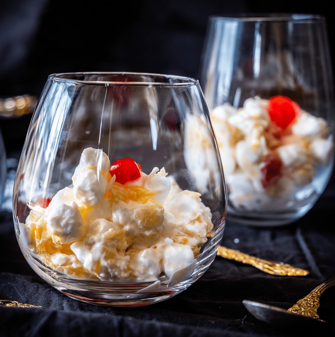 Marshmallow salad in cocktail glasses.