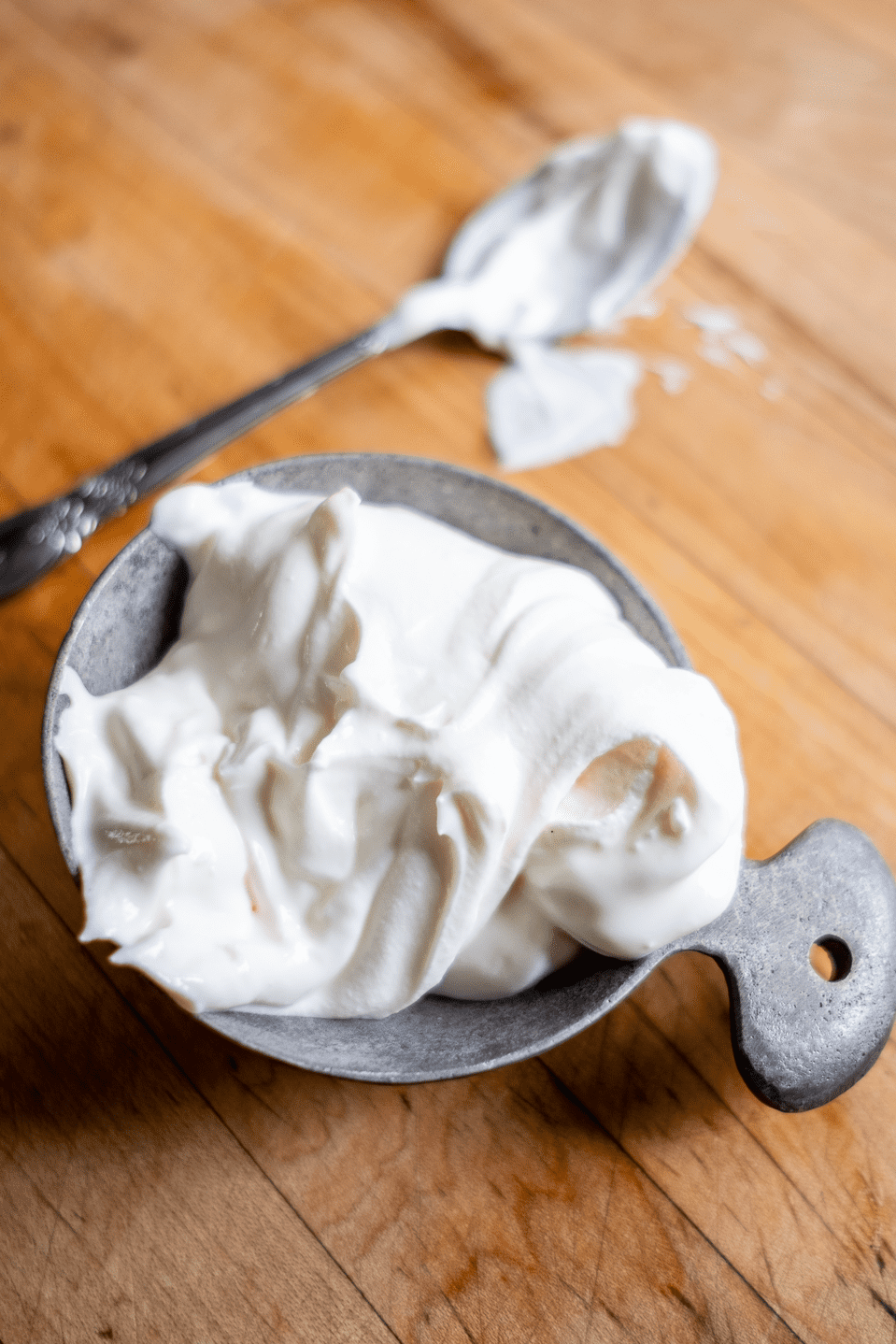 Sour cream in a measuring cup.