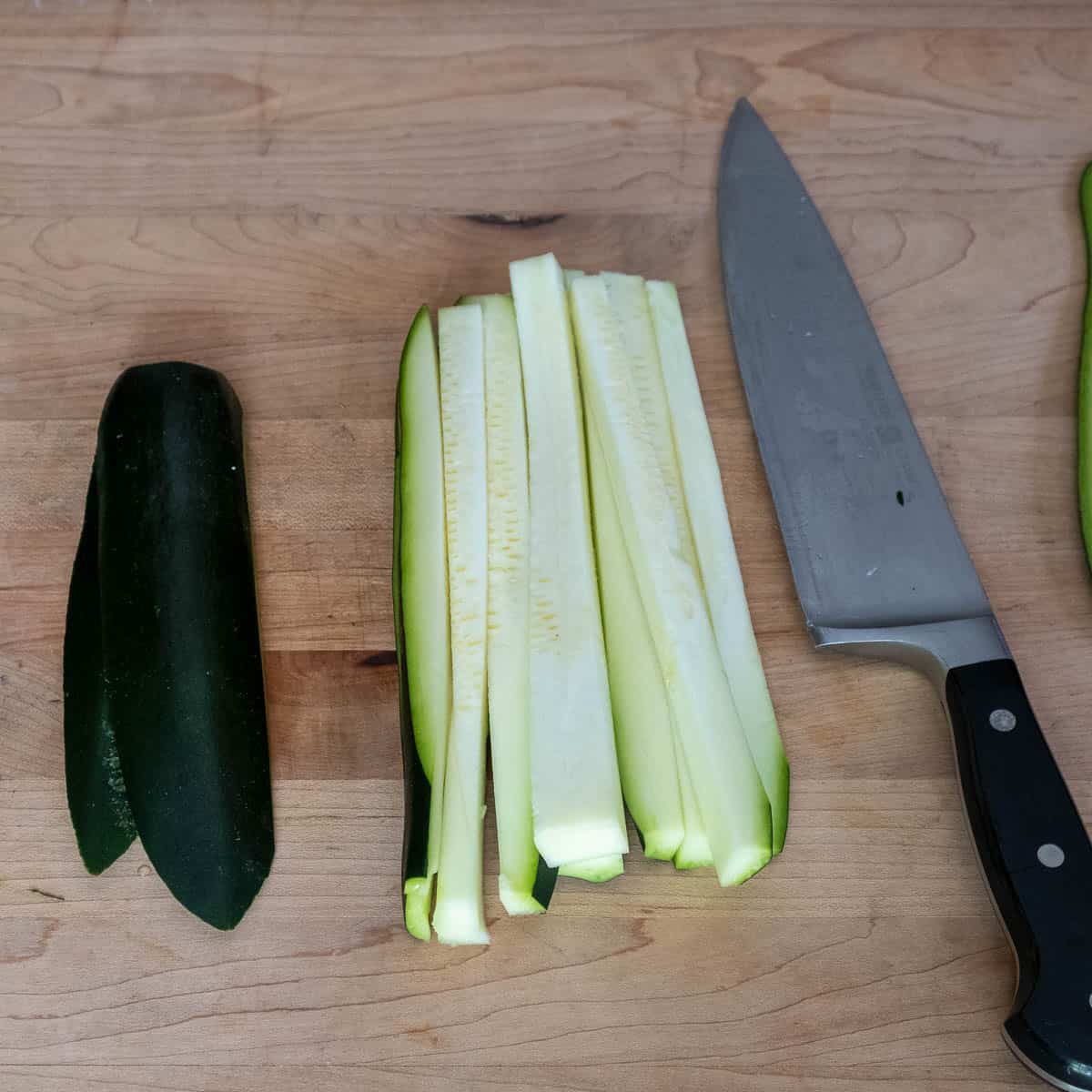 Zucchini cut into batons ready for dicing.