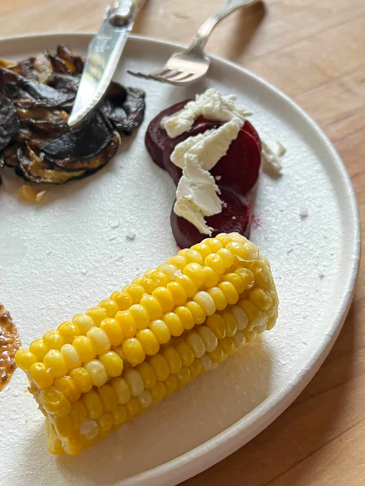 Frozen corn on the cob after reheating.