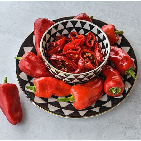 Leutschauer Paprika Hot Pepper on black and white plate.